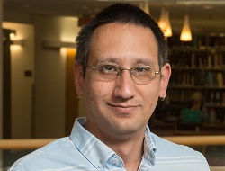 Shin Amano stands in the W. W. Hagerty Library